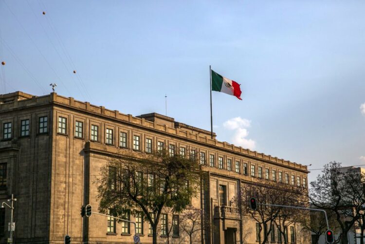 A Mexican flag flies outside the Supreme Court of Justice of the Nation (SCJN) in Mexico City, Mexico, on Friday, Feb. 16, 2018. The National Institute of Statistics and Geography (INEGI) is scheduled to release gross domestic product (GDP) figures on February 23. Photographer: Alejandro Cegarra/Bloomberg